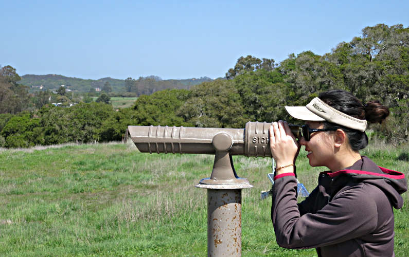 Nadia Looking Through a Telescope at Elkhorn Slough National Estuarine Research Reserve