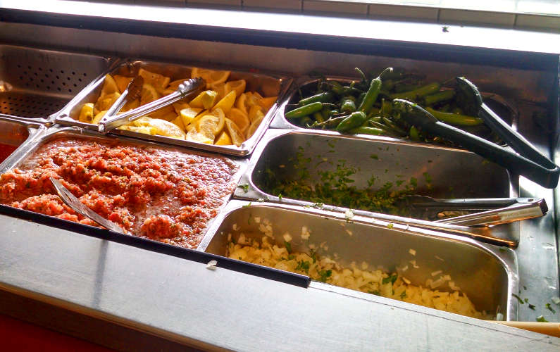 Super Taquiera's Salsa Bar with Chilis and Lemons and More Salsa
