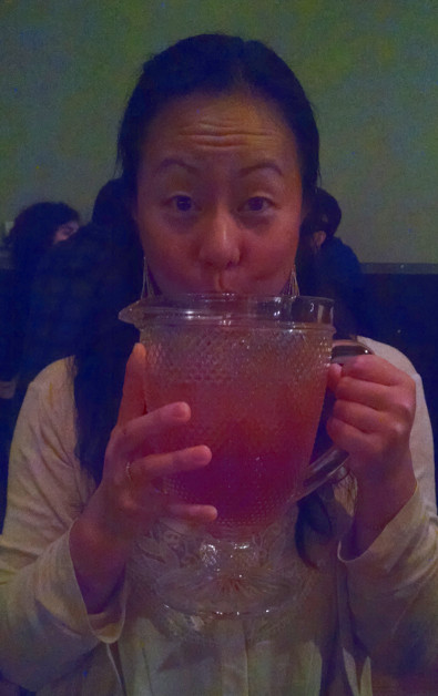 Nadia Sipping a Pitcher of Paper Plane's Signature Drink