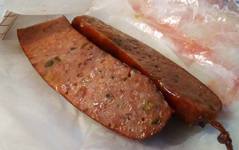 Close Up of Split in Half Lengthwise Rudy's BBQ Sausage