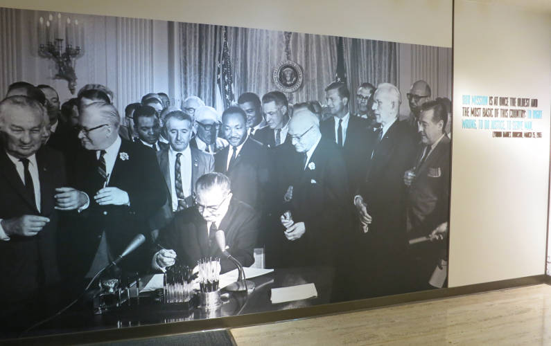 Wall Picture of a Crowd Watching Lyndon B Johnson Signing Paperwork