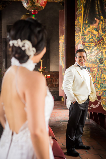 Out of Focus Nadia in a White Dress Looking at JM in a Black and White Tuxedo at Lungshan Temple By Ching Hua Bridal Art
