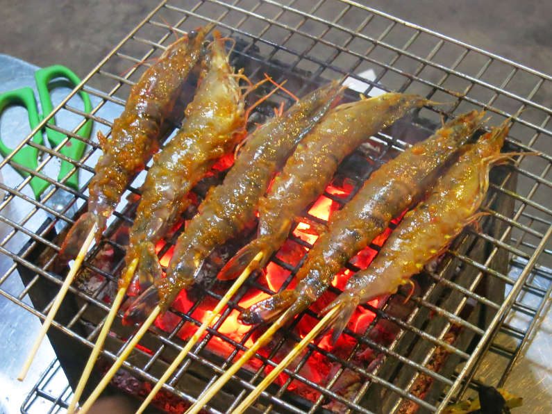 Grilling Shrimp Skewers During XO Tours Saigon