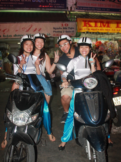 Nadia and JM with XO Tour Guides on Scooters in Saigon